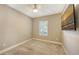 Empty bedroom with neutral walls, white trim, and plantation shutters at 5737 Semolino St, Nokomis, FL 34275