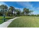 Community dog park with walking paths and benches at 5737 Semolino St, Nokomis, FL 34275