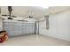 Two-car garage with storage space and overhead door at 5737 Semolino St, Nokomis, FL 34275