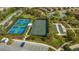 Community tennis and pickleball courts with shaded seating area at 5737 Semolino St, Nokomis, FL 34275