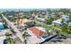 Aerial view of home with red tile roof in neighborhood under construction at 579 Bayview Dr, Longboat Key, FL 34228
