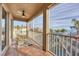 Balcony with a ceiling fan and views of the ocean at 591 Putting Green Ln, Longboat Key, FL 34228