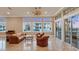 Spacious Gathering room with water views and comfortable seating at 591 Putting Green Ln, Longboat Key, FL 34228