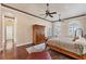 Main bedroom with hardwood floors and large windows at 591 Putting Green Ln, Longboat Key, FL 34228