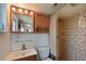 Bathroom with shower, vanity, and wood cabinet at 5927 17Th W St # A21, Bradenton, FL 34207