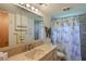Clean bathroom with a large vanity, shower, and decorative accents at 5927 17Th W St # A21, Bradenton, FL 34207