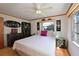 Bedroom with queen bed, wood floors, and Asian decor at 5927 17Th W St # A21, Bradenton, FL 34207