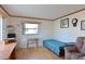Guest bedroom with twin bed, wood floors, and a desk at 5927 17Th W St # A21, Bradenton, FL 34207