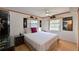 Main bedroom with a queen bed and ceiling fan at 5927 17Th W St # A21, Bradenton, FL 34207