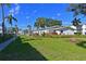 Community features a well-maintained lawn and tropical landscaping at 5927 17Th W St # A21, Bradenton, FL 34207