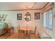 Small dining area with round table, chairs, and a chandelier at 5927 17Th W St # A21, Bradenton, FL 34207