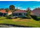 A Florida home with a screened-in pool and lush landscaping at 616 Misty Pond Ct, Bradenton, FL 34212