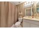 Bathroom with shower/tub combo, vanity, and toilet at 616 Misty Pond Ct, Bradenton, FL 34212