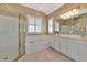 Spacious bathroom with double vanity, soaking tub, and separate shower at 616 Misty Pond Ct, Bradenton, FL 34212