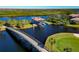 Wooden bridge leading to boat dock and golf course at 616 Misty Pond Ct, Bradenton, FL 34212