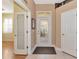 Foyer with decorative glass front door, tile flooring, and adjacent rooms at 616 Misty Pond Ct, Bradenton, FL 34212