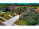 Aerial view of a home's front yard, driveway, and landscaping at 616 Misty Pond Ct, Bradenton, FL 34212