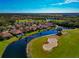 Scenic view of a golf course community with water features at 616 Misty Pond Ct, Bradenton, FL 34212