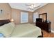 Spacious main bedroom with a ceiling fan, dresser, TV, and large bed at 616 Misty Pond Ct, Bradenton, FL 34212