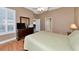 Main bedroom with a ceiling fan, a bed, and access to the bathroom and a closet at 616 Misty Pond Ct, Bradenton, FL 34212
