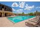 Resort-style pool with plenty of lounge chairs at 616 Misty Pond Ct, Bradenton, FL 34212