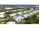 Birds-eye view of the neighborhood, including a canal and various homes at 6913 8Th W Ave, Bradenton, FL 34209