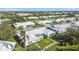 Picturesque aerial shot of a residential neighborhood featuring neat landscaping and community amenities at 6913 8Th W Ave, Bradenton, FL 34209