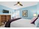 Bedroom with blue walls, hardwood flooring, and lots of natural light at 6913 8Th W Ave, Bradenton, FL 34209