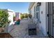 A charming courtyard area features white stone ground cover with benches, flower pots, and white privacy walls at 6913 8Th W Ave, Bradenton, FL 34209