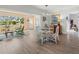 Bright dining area featuring a glass table and seating area with ample natural light and wood floors at 6913 8Th W Ave, Bradenton, FL 34209