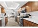 Modern kitchen featuring sleek countertops, stainless steel appliances, and ample cabinet space with wood floors at 6913 8Th W Ave, Bradenton, FL 34209