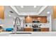 Well-lit kitchen with stainless steel appliances, quartz countertops, tile backsplash and modern fixtures at 6913 8Th W Ave, Bradenton, FL 34209
