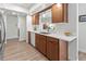 Modern kitchen with wood cabinetry, quartz countertops, and a stylish backsplash at 6913 8Th W Ave, Bradenton, FL 34209