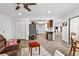 Open concept living room connecting to kitchen and outdoor patio at 6913 8Th W Ave, Bradenton, FL 34209