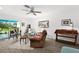Bright living room with glass doors to the lanai, cozy seating and lots of natural light at 6913 8Th W Ave, Bradenton, FL 34209