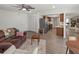 Spacious living area with wood-look flooring, leading into kitchen with stainless steel appliances at 6913 8Th W Ave, Bradenton, FL 34209