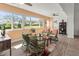Cozy sunroom with large windows and wicker furniture, providing a relaxing space with natural light at 6913 8Th W Ave, Bradenton, FL 34209