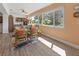 Home office featuring large windows and a built-in desk with storage, creating an inviting workspace at 6913 8Th W Ave, Bradenton, FL 34209