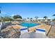 Community pool with shallow end and pool side furniture at 6913 8Th W Ave, Bradenton, FL 34209