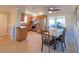 Eat-in kitchen with stainless steel appliances and wooden cabinetry at 711 Coquina Ct, Nokomis, FL 34275