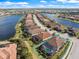 Aerial view of community showcasing waterfront homes, landscaping, and community layout at 7130 Whittlebury Trl, Bradenton, FL 34202