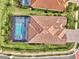 An aerial view of the home and pool with a screened enclosure at 7130 Whittlebury Trl, Bradenton, FL 34202