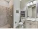 Elegant bathroom boasts a glass-enclosed shower and sleek vanity with modern fixtures at 7130 Whittlebury Trl, Bradenton, FL 34202