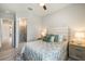 Bright bedroom with a comfortable bed, soft lighting, and an en-suite bathroom at 7130 Whittlebury Trl, Bradenton, FL 34202