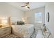 Inviting bedroom with a comfortable bed, soft lighting, and stylish decor at 7130 Whittlebury Trl, Bradenton, FL 34202