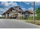 Elegant clubhouse with stone accents, manicured landscaping, and covered entrance at 7130 Whittlebury Trl, Bradenton, FL 34202
