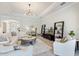 Bright, open-concept living room with neutral colors, sleek furniture and lots of space at 7130 Whittlebury Trl, Bradenton, FL 34202