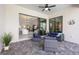 Relaxing covered patio features modern outdoor seating and seamless indoor-outdoor flow at 7130 Whittlebury Trl, Bradenton, FL 34202