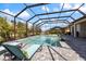 Sparkling screened-in pool with plenty of deck space for relaxing and enjoying the outdoors at 7130 Whittlebury Trl, Bradenton, FL 34202