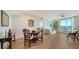 Bright dining area with hardwood floors and a round table at 800 N Tamiami Trl # 403, Sarasota, FL 34236